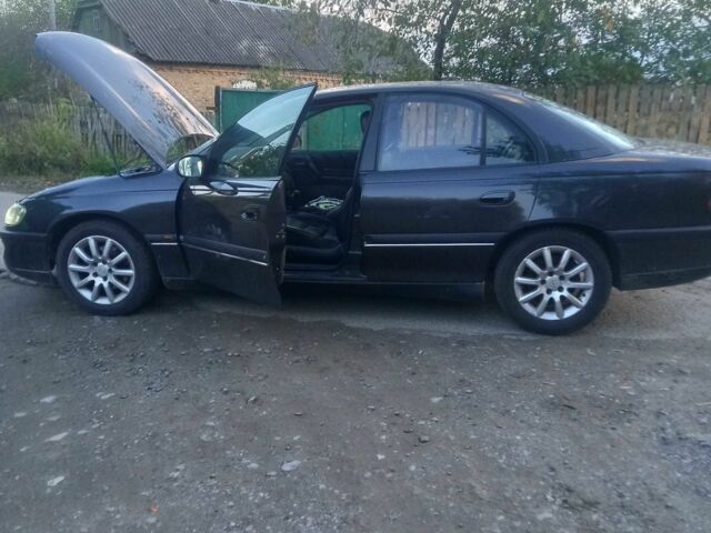 Сірий Опель Омега, об'ємом двигуна 2 л та пробігом 360 тис. км за 2300 $, фото 5 на Automoto.ua