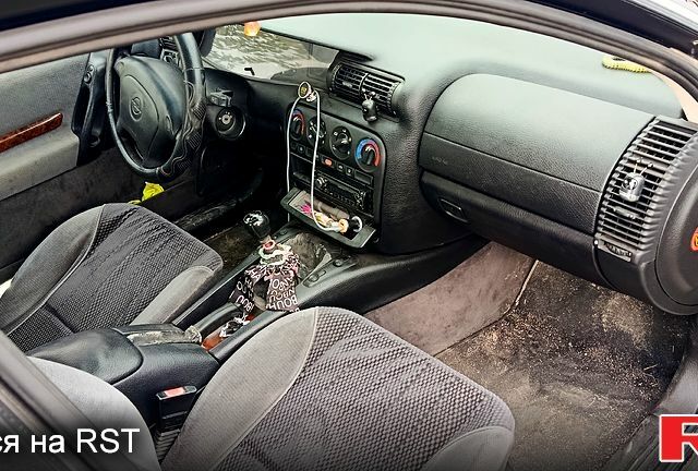 Сірий Опель Омега, об'ємом двигуна 2 л та пробігом 305 тис. км за 4300 $, фото 4 на Automoto.ua