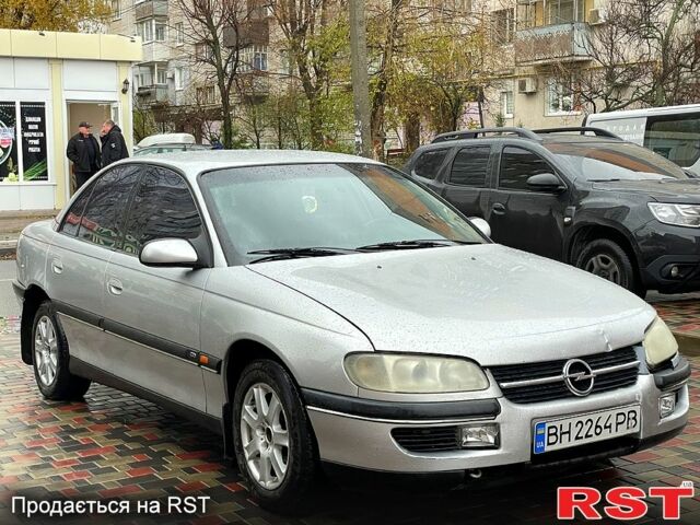 Серый Опель Омега, объемом двигателя 2.5 л и пробегом 300 тыс. км за 2000 $, фото 7 на Automoto.ua