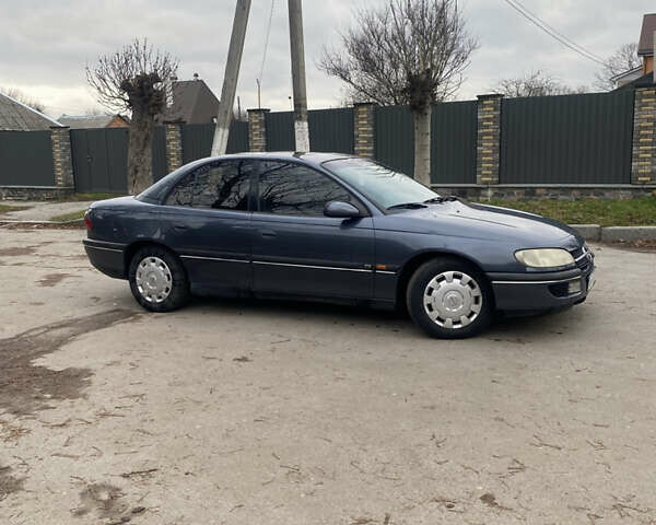 Серый Опель Омега, объемом двигателя 2 л и пробегом 235 тыс. км за 2600 $, фото 2 на Automoto.ua