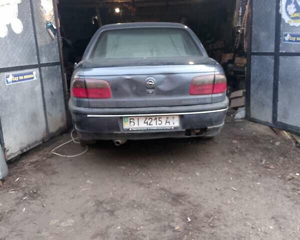 Серый Опель Омега, объемом двигателя 2.5 л и пробегом 100 тыс. км за 700 $, фото 1 на Automoto.ua