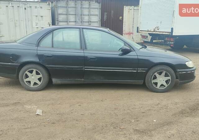 Серый Опель Омега, объемом двигателя 2.5 л и пробегом 300 тыс. км за 1700 $, фото 3 на Automoto.ua