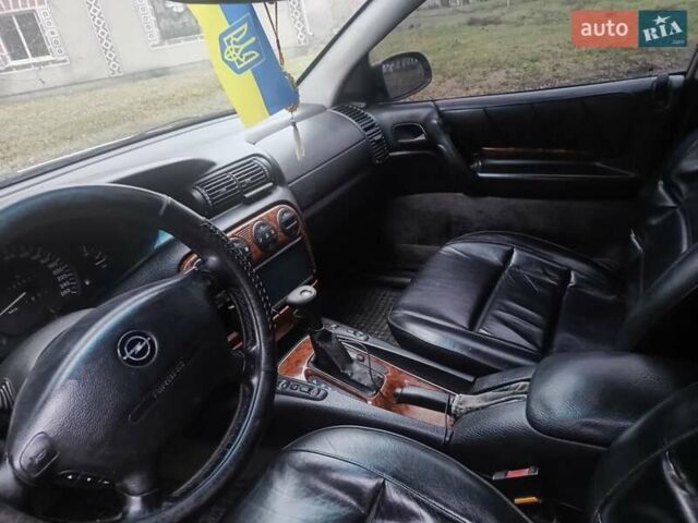 Серый Опель Омега, объемом двигателя 2.5 л и пробегом 398 тыс. км за 2400 $, фото 13 на Automoto.ua