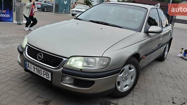 Серый Опель Омега, объемом двигателя 2.5 л и пробегом 380 тыс. км за 2700 $, фото 1 на Automoto.ua