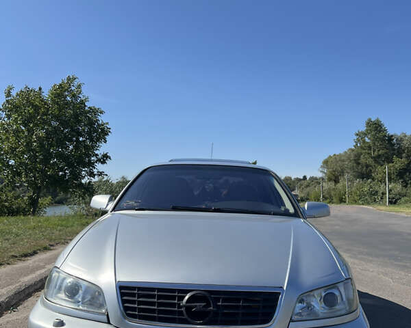 Серый Опель Омега, объемом двигателя 2.6 л и пробегом 360 тыс. км за 4150 $, фото 5 на Automoto.ua