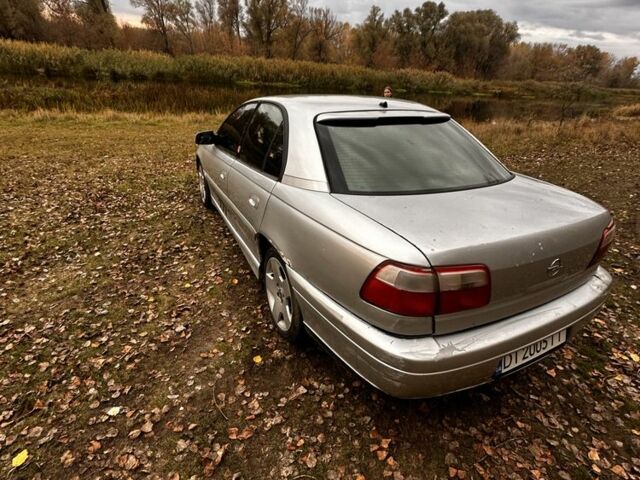 Серый Опель Омега, объемом двигателя 2.5 л и пробегом 225 тыс. км за 2158 $, фото 4 на Automoto.ua