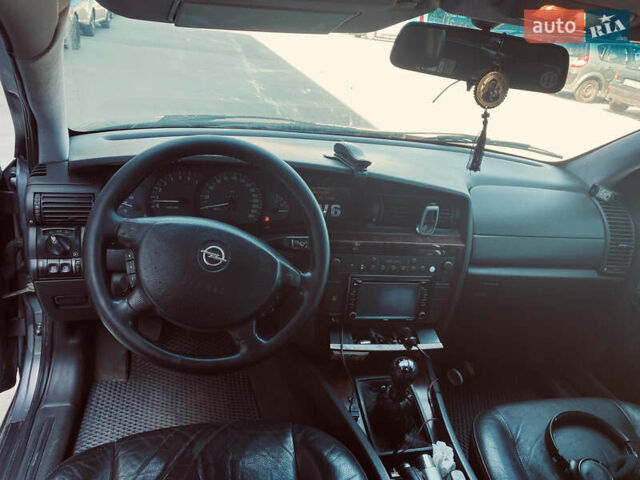Серый Опель Омега, объемом двигателя 2.6 л и пробегом 368 тыс. км за 3600 $, фото 12 на Automoto.ua