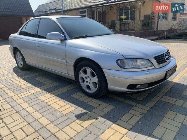 Серый Опель Омега, объемом двигателя 2.6 л и пробегом 300 тыс. км за 5000 $, фото 4 на Automoto.ua