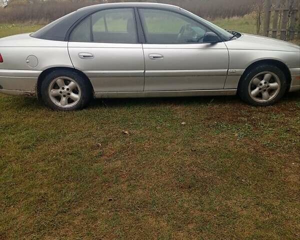 Серый Опель Омега, объемом двигателя 2.2 л и пробегом 331 тыс. км за 1900 $, фото 4 на Automoto.ua