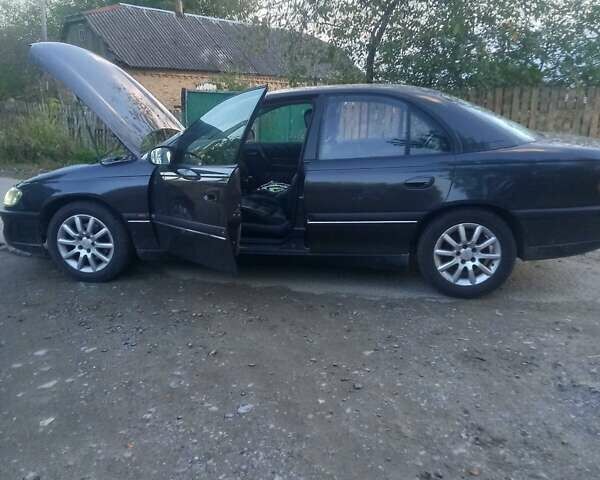 Сірий Опель Омега, об'ємом двигуна 2 л та пробігом 360 тис. км за 2300 $, фото 4 на Automoto.ua
