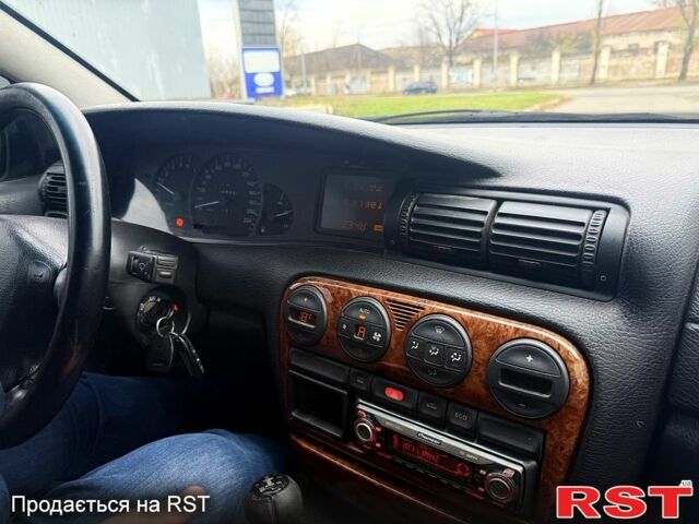 Сірий Опель Омега, об'ємом двигуна 2 л та пробігом 247 тис. км за 1999 $, фото 9 на Automoto.ua