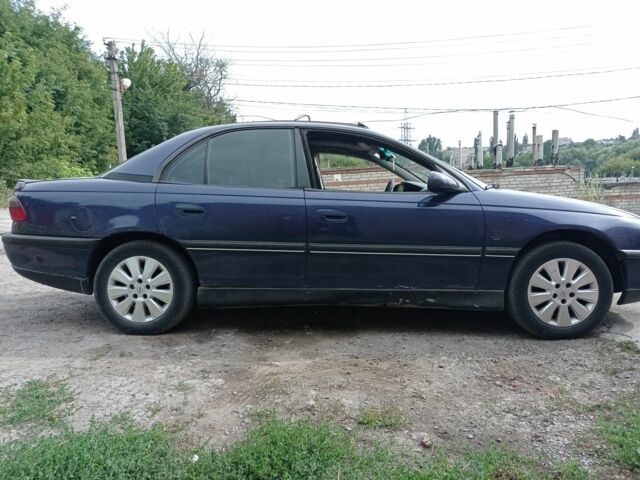 Синий Опель Омега, объемом двигателя 3 л и пробегом 216 тыс. км за 800 $, фото 1 на Automoto.ua