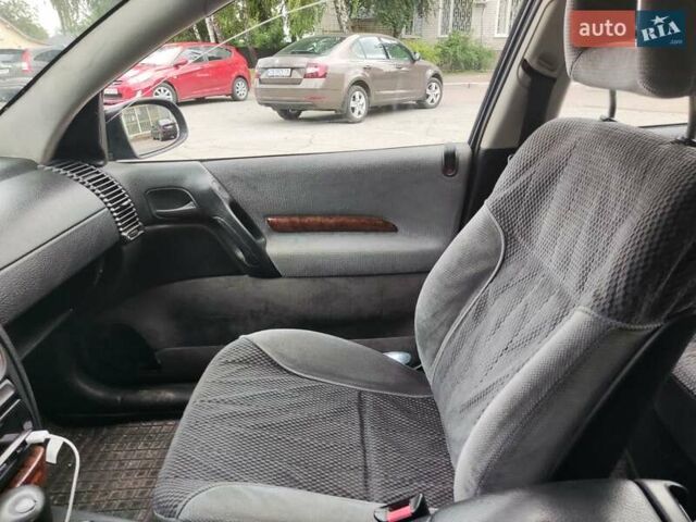 Синій Опель Омега, об'ємом двигуна 2 л та пробігом 312 тис. км за 1200 $, фото 4 на Automoto.ua