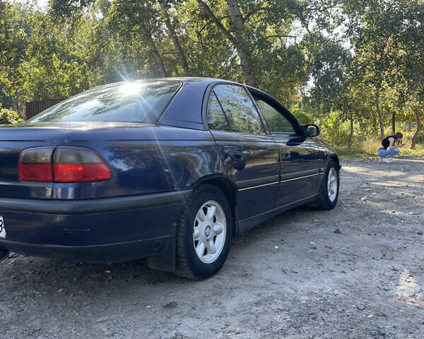 Синий Опель Омега, объемом двигателя 2.5 л и пробегом 480 тыс. км за 1799 $, фото 4 на Automoto.ua