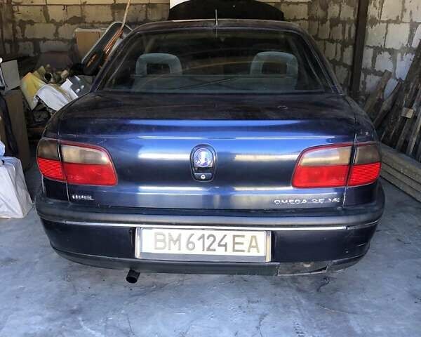 Синий Опель Омега, объемом двигателя 2.5 л и пробегом 322 тыс. км за 1000 $, фото 1 на Automoto.ua