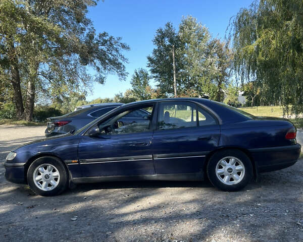 Синий Опель Омега, объемом двигателя 2.5 л и пробегом 480 тыс. км за 1799 $, фото 1 на Automoto.ua