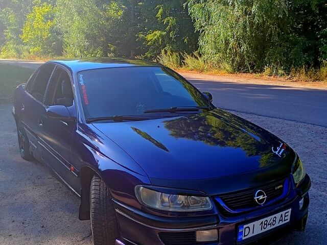 Синий Опель Омега, объемом двигателя 2 л и пробегом 329 тыс. км за 1699 $, фото 4 на Automoto.ua