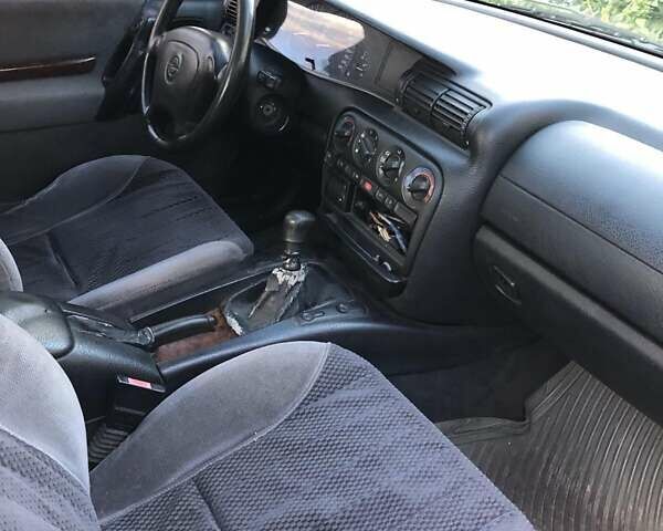 Синий Опель Омега, объемом двигателя 2.5 л и пробегом 322 тыс. км за 1000 $, фото 3 на Automoto.ua