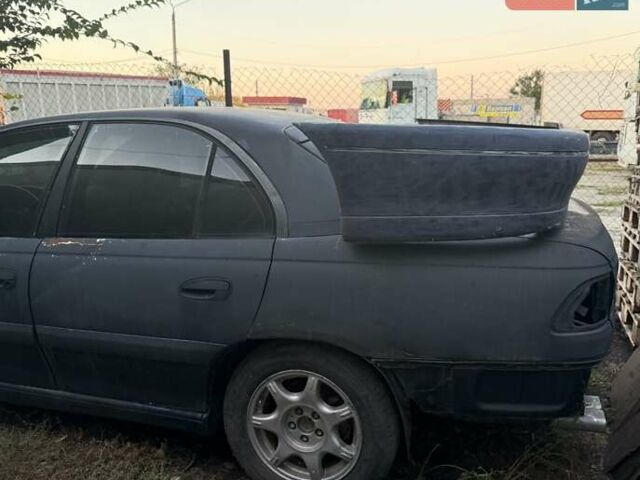 Синий Опель Омега, объемом двигателя 3 л и пробегом 560 тыс. км за 1500 $, фото 3 на Automoto.ua