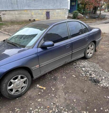 Синий Опель Омега, объемом двигателя 2 л и пробегом 280 тыс. км за 800 $, фото 1 на Automoto.ua