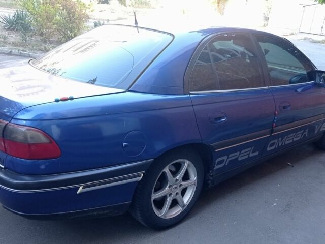 Синий Опель Омега, объемом двигателя 2.5 л и пробегом 289 тыс. км за 1600 $, фото 4 на Automoto.ua