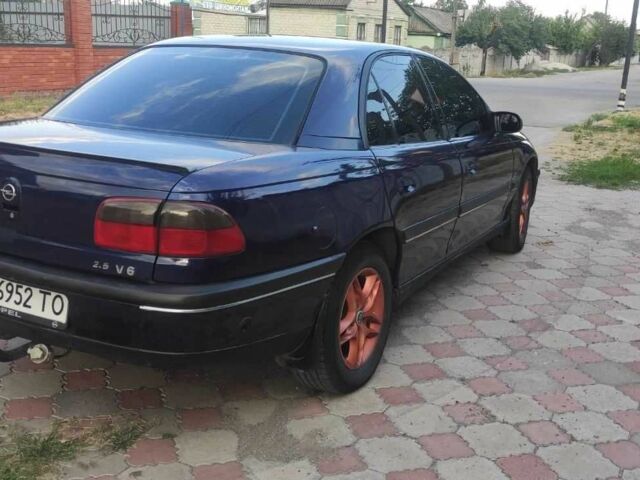 Синий Опель Омега, объемом двигателя 2.5 л и пробегом 385 тыс. км за 3400 $, фото 2 на Automoto.ua