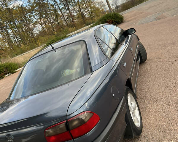 Опель Омега 1998 в Бучаче на Automoto.ua Синий Опель Омега, объемом двигателя 2 л и пробегом 300 тыс. км за 2600 $, фото 5 на Automoto.ua