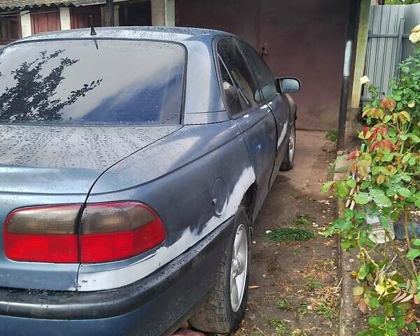 Синий Опель Омега, объемом двигателя 2.5 л и пробегом 300 тыс. км за 900 $, фото 4 на Automoto.ua