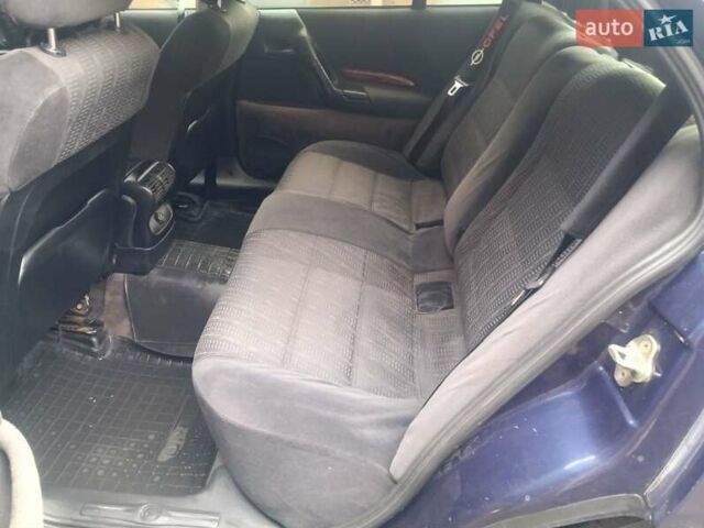 Синій Опель Омега, об'ємом двигуна 2 л та пробігом 294 тис. км за 2000 $, фото 23 на Automoto.ua