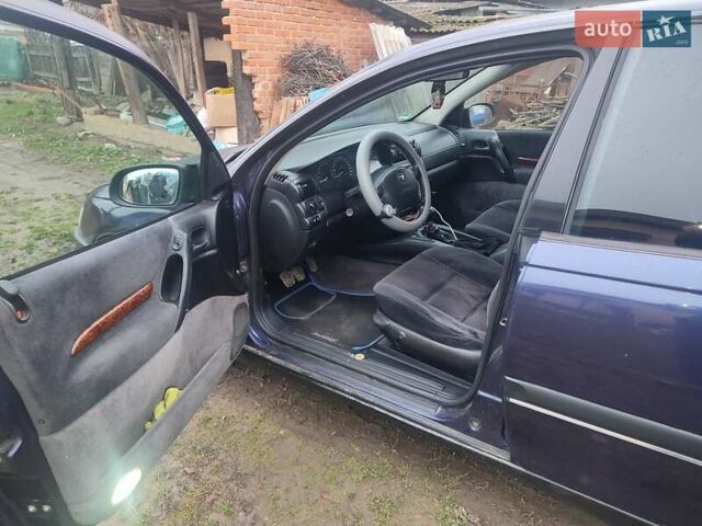 Синій Опель Омега, об'ємом двигуна 2 л та пробігом 370 тис. км за 2800 $, фото 9 на Automoto.ua