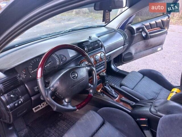 Синий Опель Омега, объемом двигателя 2.5 л и пробегом 285 тыс. км за 2400 $, фото 27 на Automoto.ua