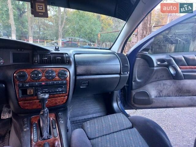 Синий Опель Омега, объемом двигателя 2.5 л и пробегом 285 тыс. км за 2400 $, фото 16 на Automoto.ua