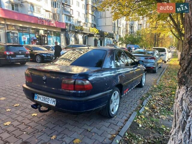 Синий Опель Омега, объемом двигателя 2.5 л и пробегом 285 тыс. км за 2400 $, фото 8 на Automoto.ua