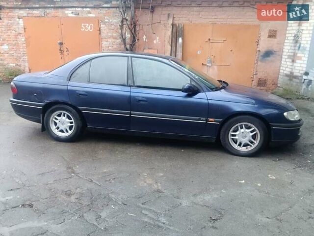 Синій Опель Омега, об'ємом двигуна 2 л та пробігом 294 тис. км за 2000 $, фото 13 на Automoto.ua