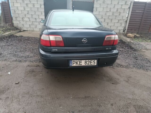 Синий Опель Омега, объемом двигателя 2.5 л и пробегом 250 тыс. км за 2200 $, фото 1 на Automoto.ua