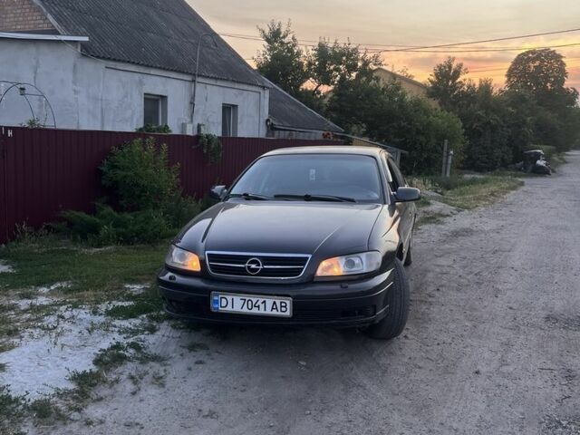 Синий Опель Омега, объемом двигателя 2.5 л и пробегом 290 тыс. км за 1789 $, фото 4 на Automoto.ua