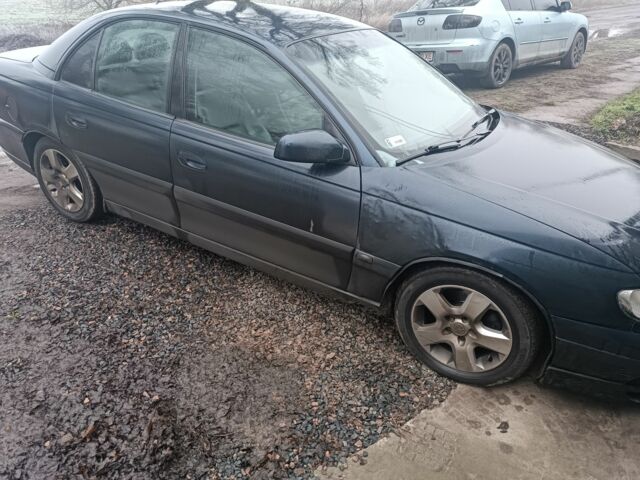 Синий Опель Омега, объемом двигателя 2.5 л и пробегом 250 тыс. км за 2200 $, фото 2 на Automoto.ua