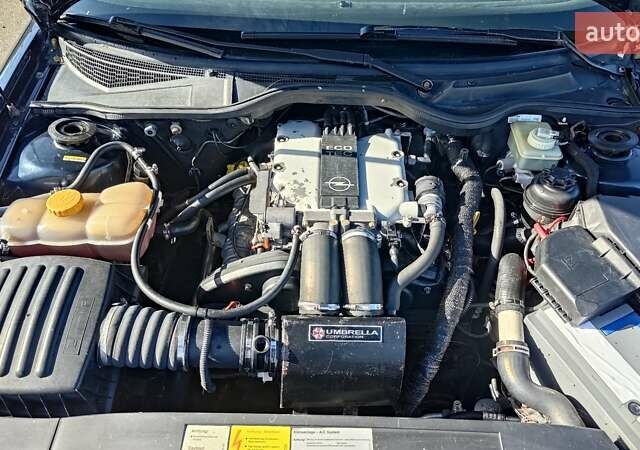 Синий Опель Омега, объемом двигателя 3 л и пробегом 350 тыс. км за 4500 $, фото 4 на Automoto.ua