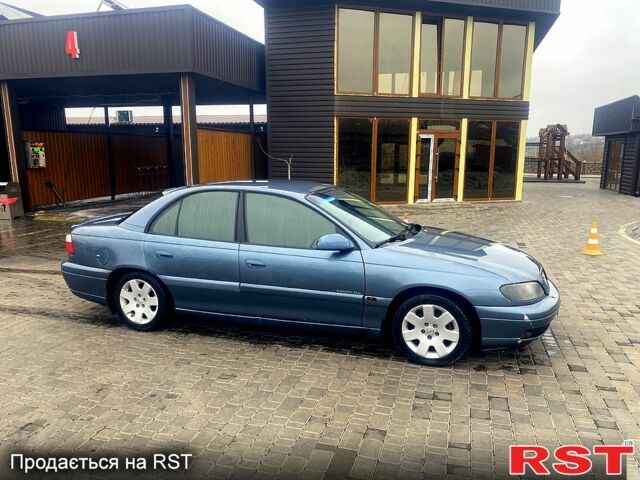 Синій Опель Омега, об'ємом двигуна 3 л та пробігом 168 тис. км за 1900 $, фото 6 на Automoto.ua