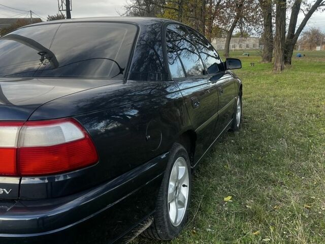 Синий Опель Омега, объемом двигателя 2.2 л и пробегом 233 тыс. км за 2750 $, фото 5 на Automoto.ua