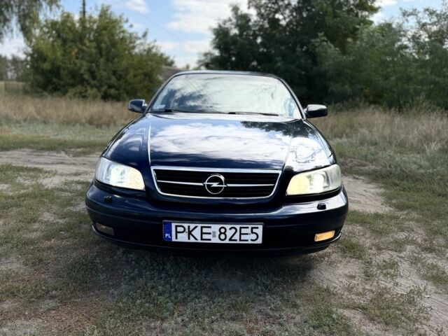 Синий Опель Омега, объемом двигателя 2.5 л и пробегом 260 тыс. км за 1450 $, фото 2 на Automoto.ua