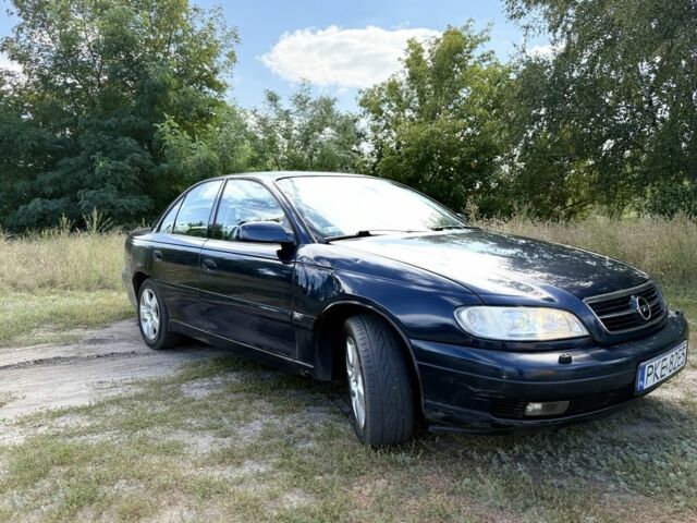 Синий Опель Омега, объемом двигателя 2.5 л и пробегом 260 тыс. км за 1450 $, фото 1 на Automoto.ua