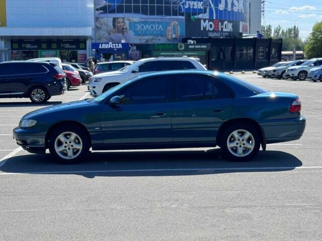 Синий Опель Омега, объемом двигателя 2.2 л и пробегом 113 тыс. км за 3500 $, фото 5 на Automoto.ua