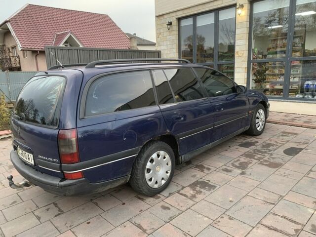 Синий Опель Омега, объемом двигателя 2.5 л и пробегом 205 тыс. км за 1650 $, фото 2 на Automoto.ua