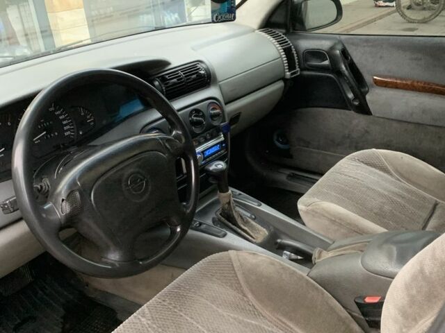 Синий Опель Омега, объемом двигателя 2.5 л и пробегом 205 тыс. км за 1650 $, фото 3 на Automoto.ua