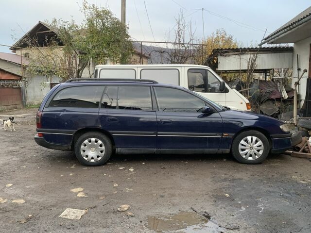 Синий Опель Омега, объемом двигателя 2.5 л и пробегом 205 тыс. км за 1650 $, фото 1 на Automoto.ua