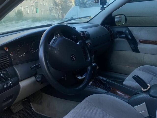 Синий Опель Омега, объемом двигателя 2.5 л и пробегом 312 тыс. км за 1750 $, фото 1 на Automoto.ua