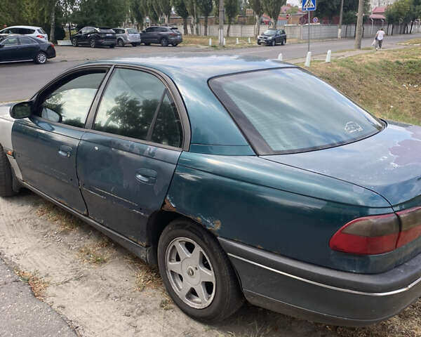 Зеленый Опель Омега, объемом двигателя 2 л и пробегом 400 тыс. км за 1250 $, фото 3 на Automoto.ua