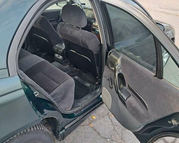 Зелений Опель Омега, об'ємом двигуна 2 л та пробігом 280 тис. км за 1899 $, фото 11 на Automoto.ua