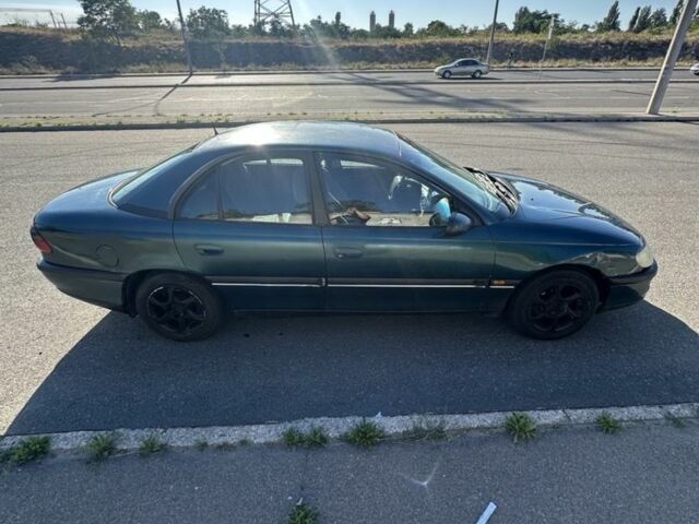 Зеленый Опель Омега, объемом двигателя 2 л и пробегом 200 тыс. км за 850 $, фото 1 на Automoto.ua